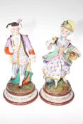 Pair Victorian bisque figures of colourful maiden and gallant, 36cm.