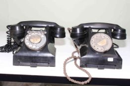 Two vintage Bakelite telephones.