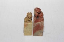 Two soapstone foo dog carvings, tallest 9cm.