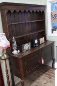 Edwardian oak and chequer inlaid dresser, the shelf back above two cupboard doors on cabriole legs,