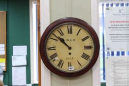 Circular wall clock, the dial marked L.N.E.R. No. 6654.
