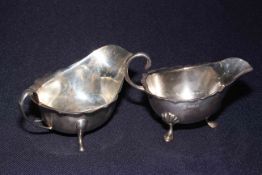 Two silver sauce boats, Sheffield 1935 and Birmingham 1908.