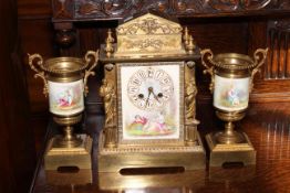 Continental porcelain and brass three piece garniture clock set.