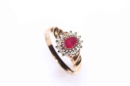 Ruby and diamond cluster, 9 carat gold ring, size L.