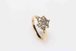 Diamond seven stone cluster 18 carat gold ring, size K/L.