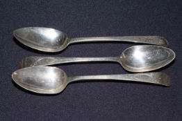Three George III silver bright cut tablespoons, one Bateman 1798, and two 1796.