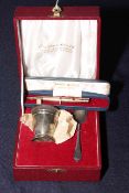 Cased silver egg cup and spoon, and cased rolled gold pencil (2).