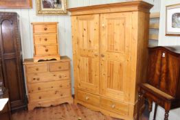 Pine four piece bedroom suite comprising double door combination wardrobe, five drawer chest,
