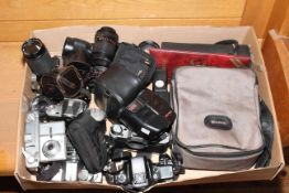 Box of cameras and lenses.