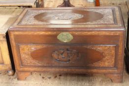 Oriental carved camphorwood trunk, 58cm by 102cm by 54cm.