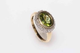 Peridot and diamond halo cluster 9 carat gold ring, size Q.