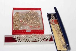 Collection of simulated pearl necklaces and boxed bracelet.