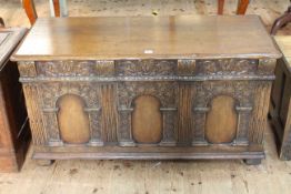Carved oak triple arched panel front coffer, 63cm by 117cm by 49cm.