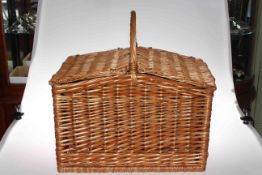 Wicker hamper picnic basket with accessories.