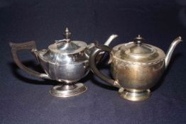 Two silver teapots, one of shaped oval form Birmingham 1896, and one Birmingham 1930.