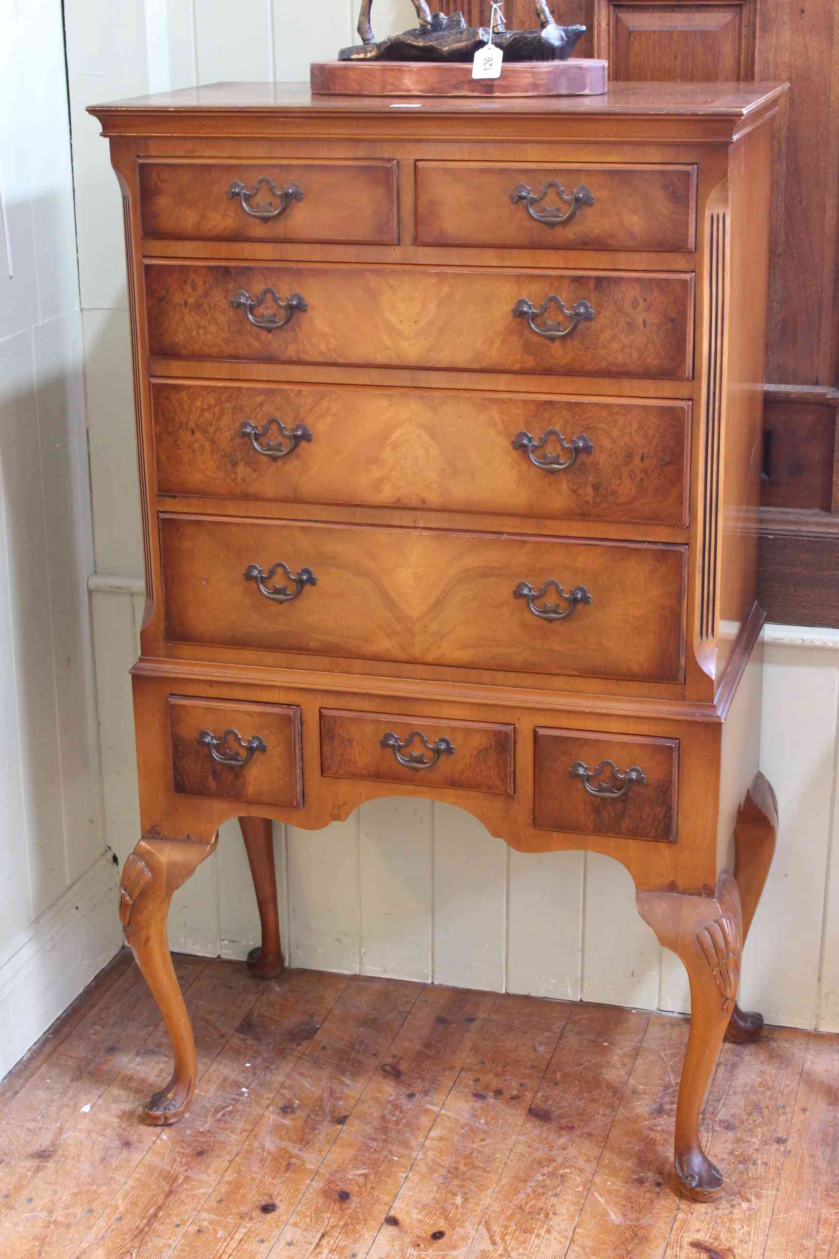 Queen Anne style walnut eight drawer chest on cabriole legs, 133cm by 75cm by 42cm.