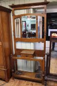 Edwardian oak mirror backed hallstand, 136cm by 106cm by 30cm.