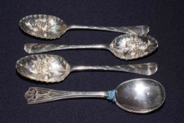 Three George III silver ornate fruit spoons, circa 1780's, and pair of spoons with pierced handles,