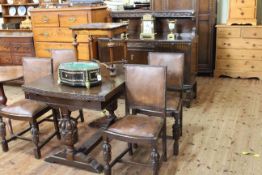 1920's/30's carved oak six piece dining suite comprising shaped front sideboard,