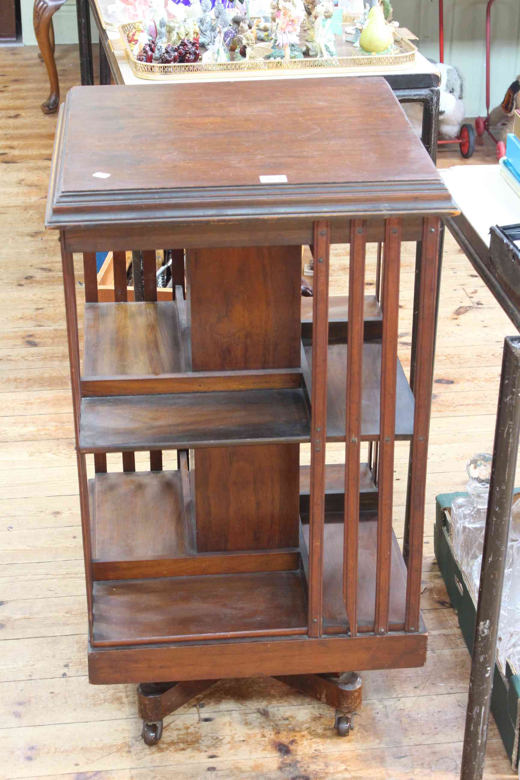 Edwardian mahogany two tier revolving bookcase, 89cm by 50cm.