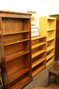 Three various open bookcases, two with adjustable shelves and one teak (tallest 183cm).