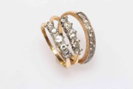 Three 18 carat gold diamond set rings.