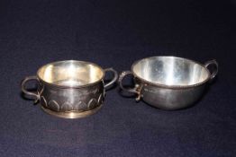 Two silver two handled bowls, one with stylised leaf decoration, Sheffield 1922,