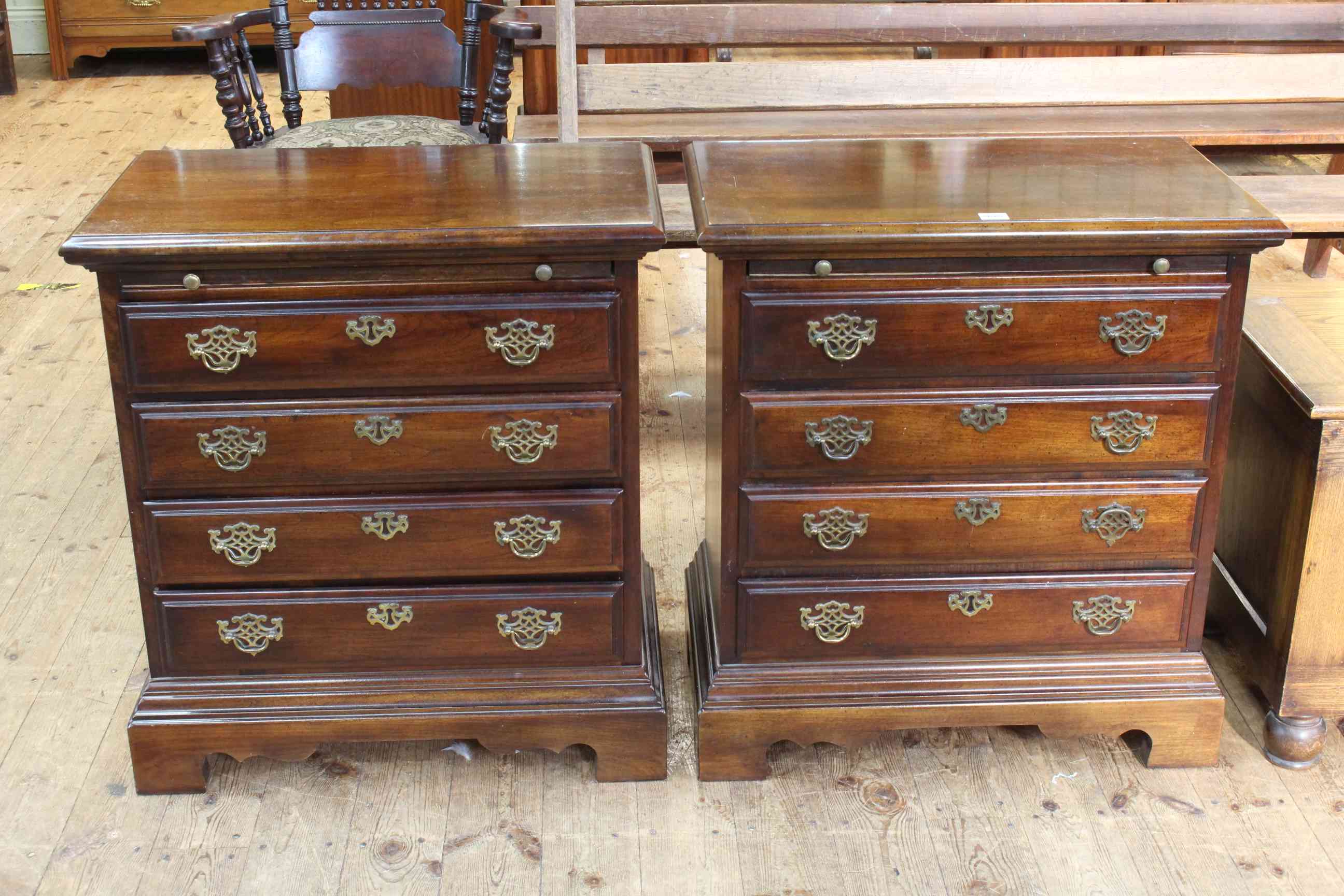 Pair Georgian style Bachelors chests having brush slides above four drawers on bracket feet,