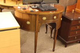 19th Century mahogany demi-lune side cabinet having frieze drawer flanked by cupboards raised on