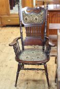 Antique American panel and spindle back elbow chair.