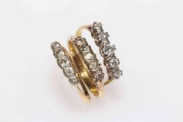 Three 18 carat gold and diamond set rings.