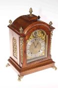 Oak and gilt metal mounted bracket clock on scroll feet, 40cm.