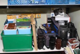 Collection of cameras, lenses and accessories.