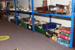 Eleven boxes of ceramics, glass, books, games, together with a tin trunk.