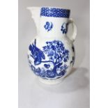Late 18th Century blue and white cabbage leaf jug with mask spout, 20cm.
