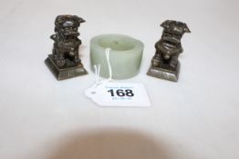 Jade Archers ring and two small bronze dog weights (3).
