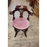 Late Victorian mahogany circular seated elbow chair.
