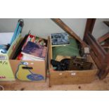 Two boxes of model train memorabilia including Triang boxed models, tracks, building accessories,