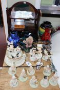 Collection of eleven Disney Showcase figures, shelf stand, Poole dolphin, vases, inlaid boxes, etc.