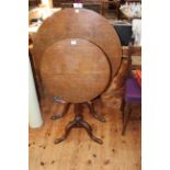 Two antique oak circular snap top tripod tables.