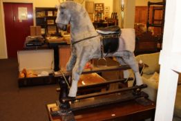 Thoroughbred Horses rocking horse on safety stand, 111cm by 121cm.