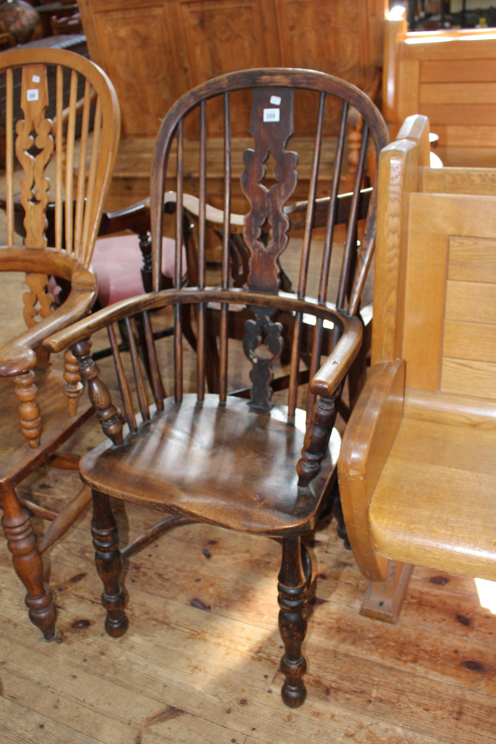 Antique Windsor pierced splat back elbow chair with crinoline stretcher.