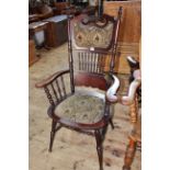 Antique American panel and spindle back elbow chair.