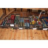 Six boxes of model railway carriages and freight wagons.