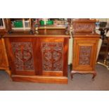 Late 19th Century carved two door fitted cabinet and similar music cabinet (2).