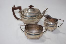 Silver three piece tea set, shaped bodies on bun feet, Birmingham 1929.