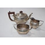 Silver three piece tea set, shaped bodies on bun feet, Birmingham 1929.