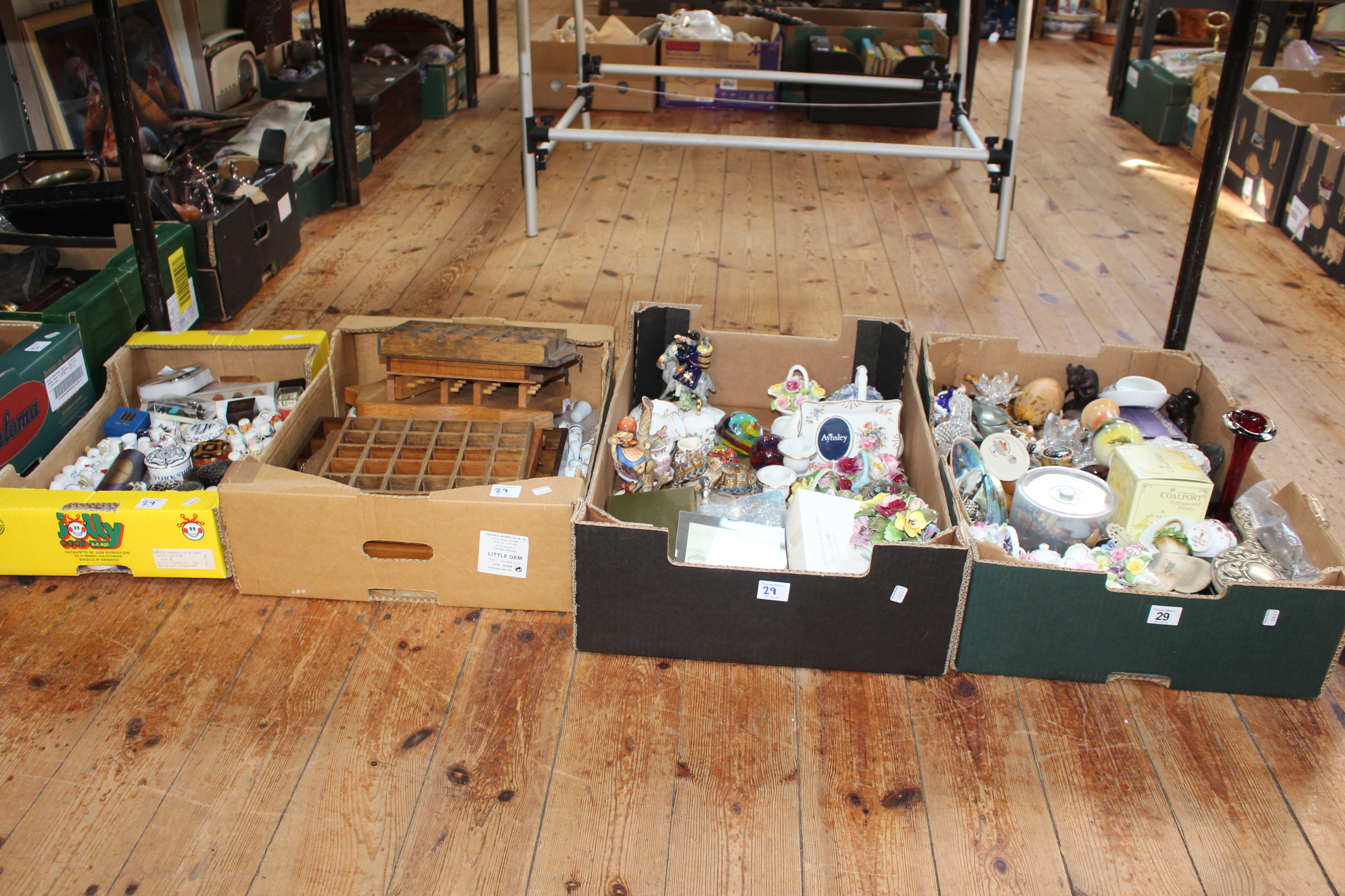 Four boxes of decorative ornaments, thimbles and racks.