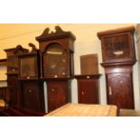 Collection of five antique longcase clock cases.