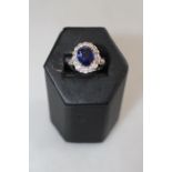 Fine sapphire and diamond cluster ring set in 18 carat white gold,